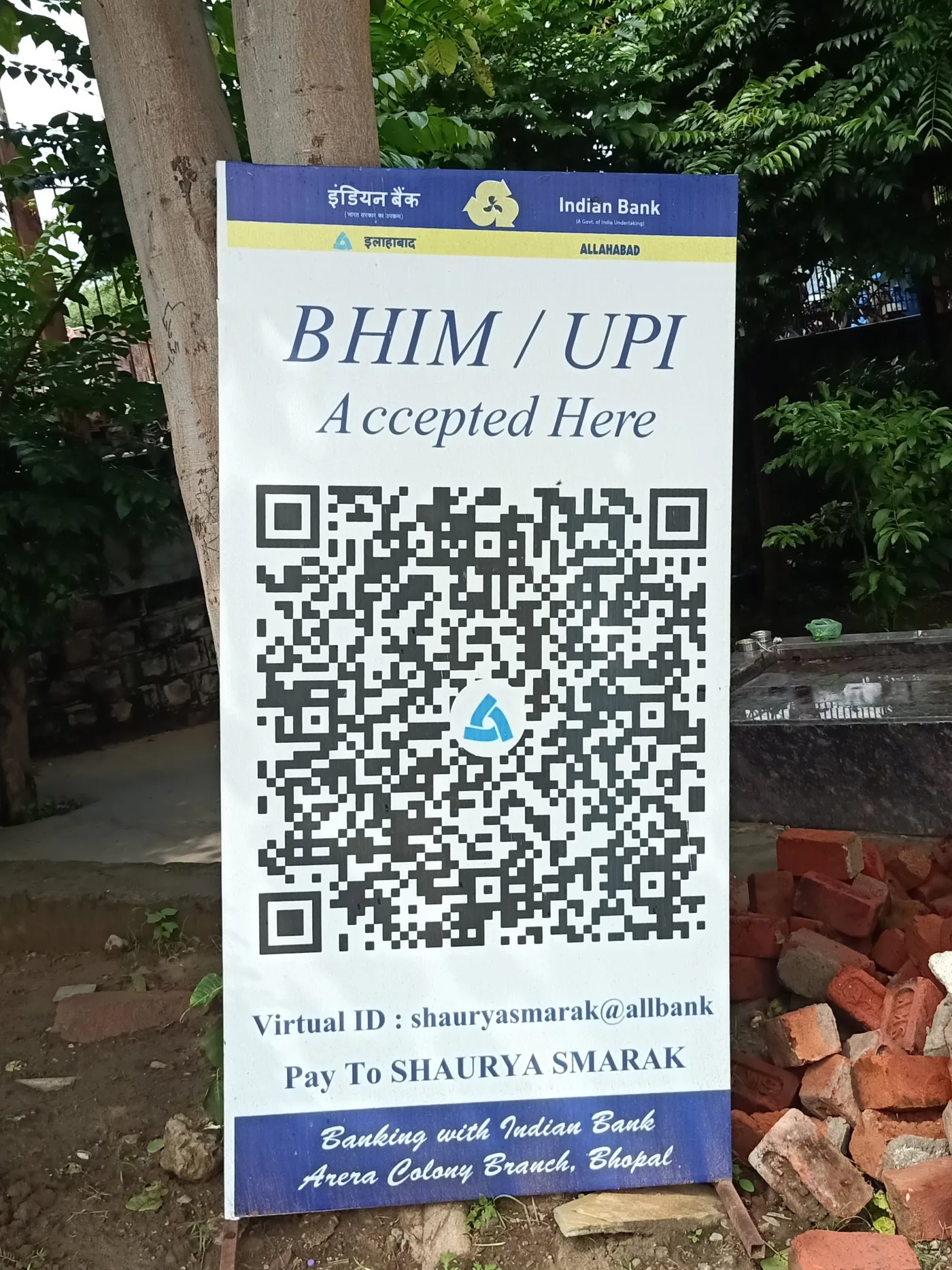 Printed paper notice at Shaurya Smarak in Bhopal showing a BHIM UPI ID and QR-style payment instructions for entrance fees