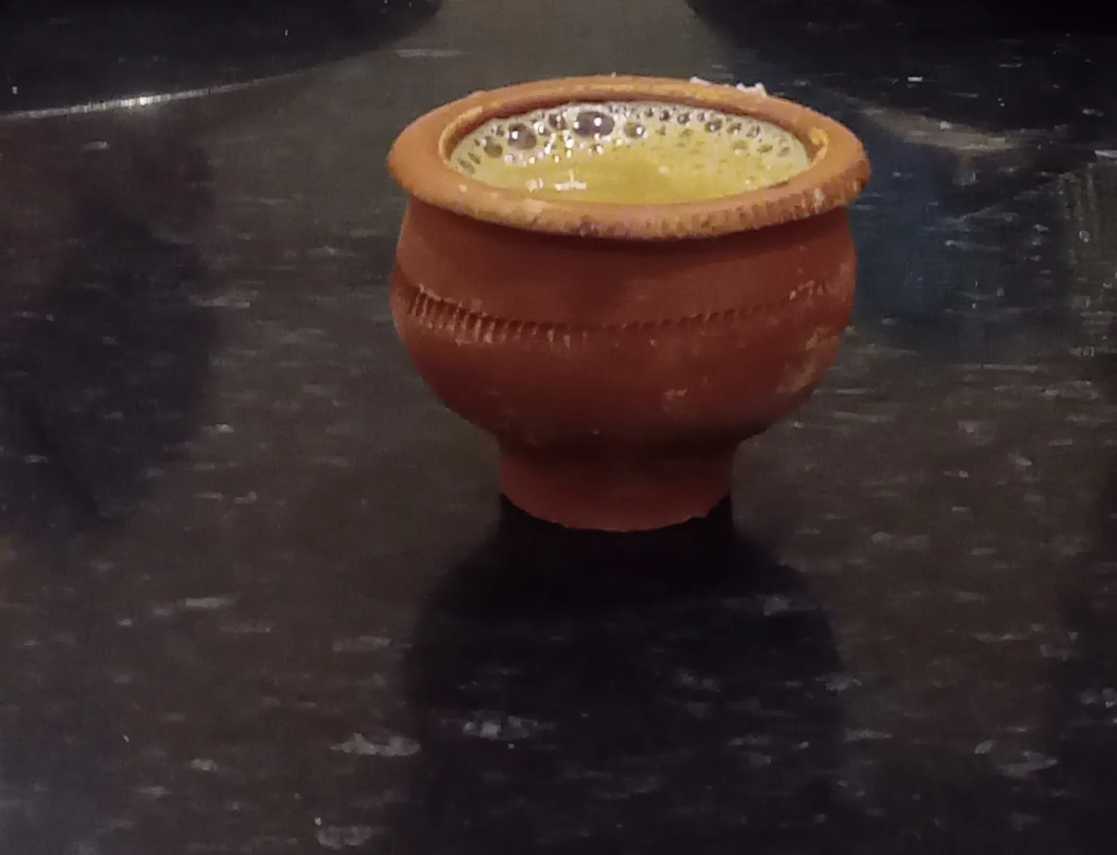 Milky tea served in a traditional Bengali earthen bhar clay cup