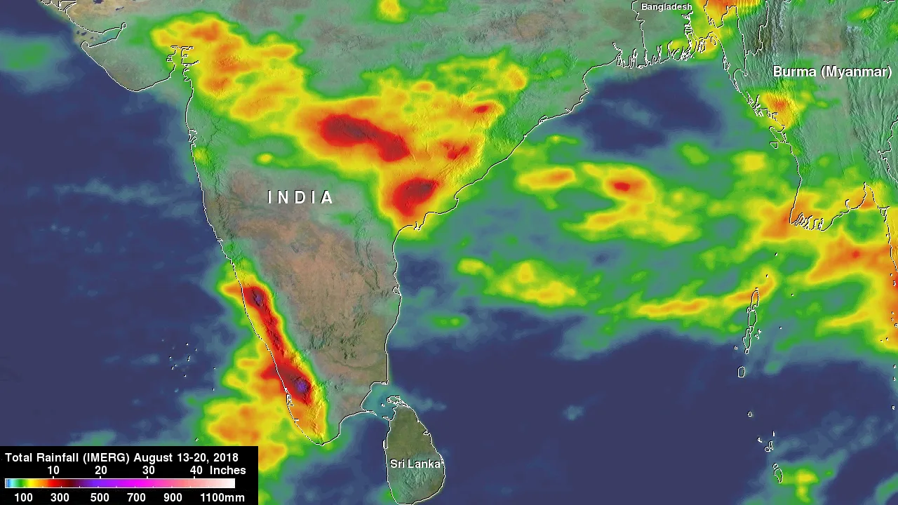 Satellite rainfall map of India for 13 to 20 August 2018, showing a broad band of heavy rain in red and yellow across central India and an intense narrow band in dark red and purple along the Kerala and Karnataka coast