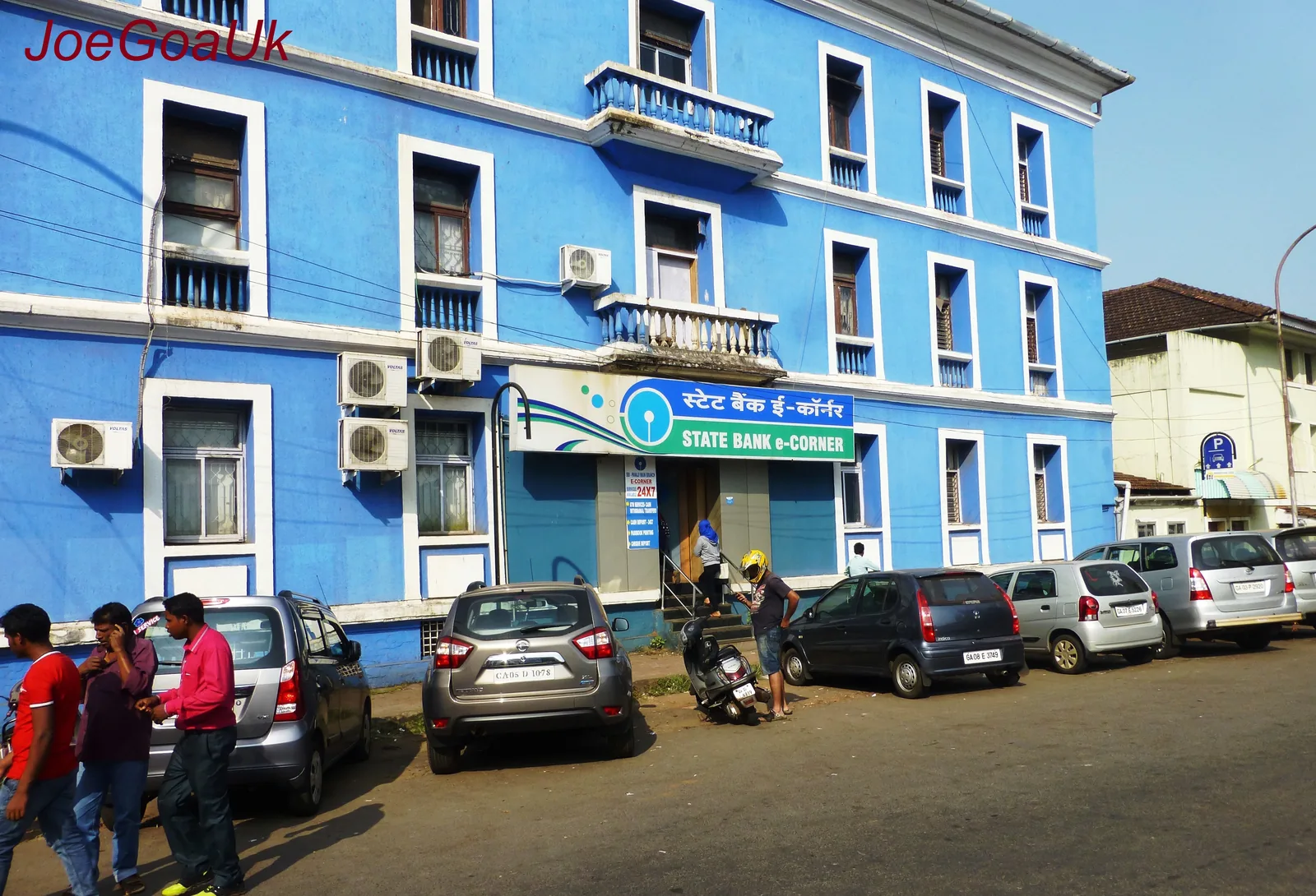 Exterior of a State Bank of India branch building with the bank logo above the entrance