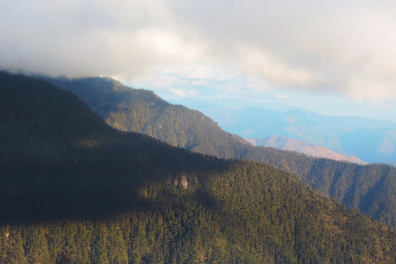 High mountain landscape of rock, snow patches and cloud near Sela Pass in Tawang district, Arunachal Pradesh