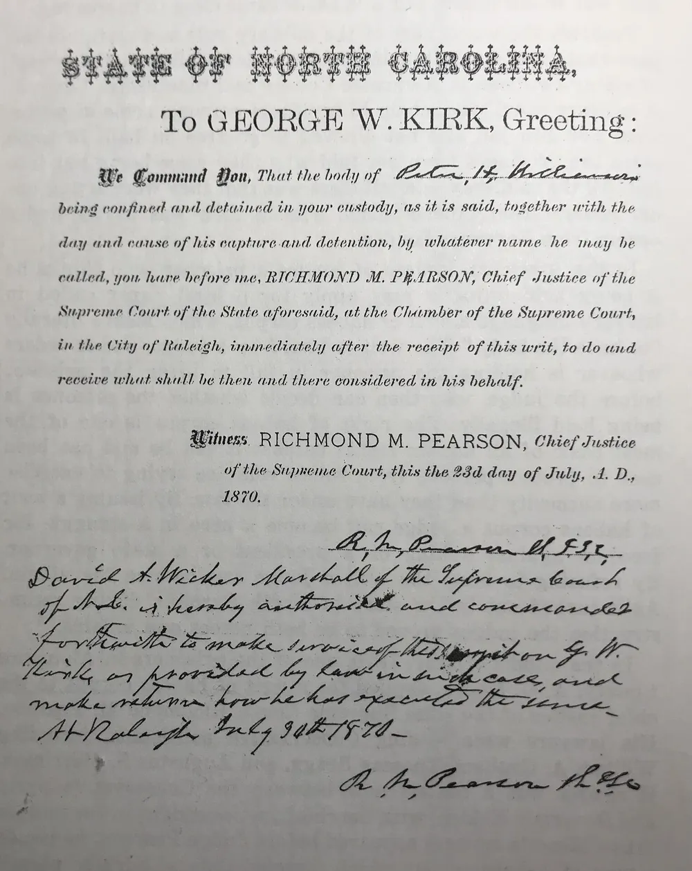 A printed writ of habeas corpus from North Carolina dated 23 July 1870, commanding George W. Kirk to bring a detained man before Chief Justice Richmond M. Pearson, with handwritten notes below