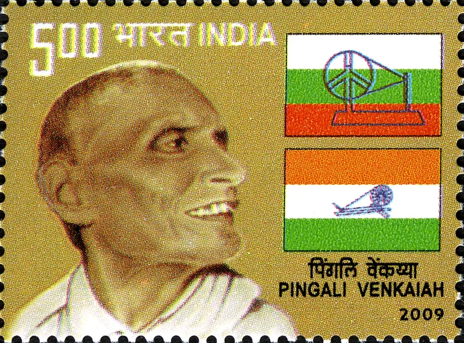 Indian postage stamp of 2009 showing a portrait of Pingali Venkayya beside two early flag designs: a white, green and red flag with a spinning wheel and a saffron, white and green flag with a spinning wheel