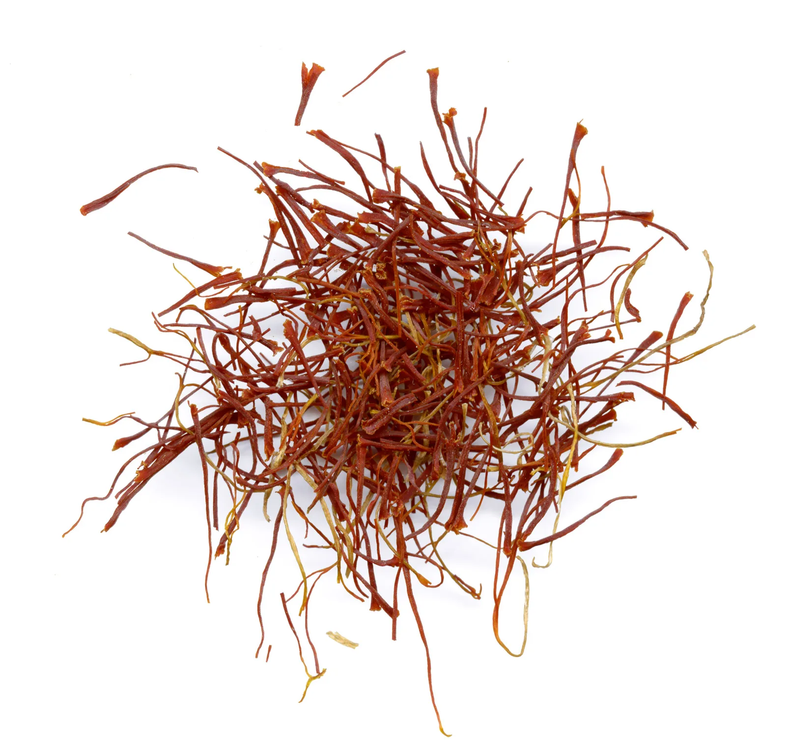 A loose pile of dried dark-red saffron threads with some pale yellow style ends mixed in, photographed on a plain white background