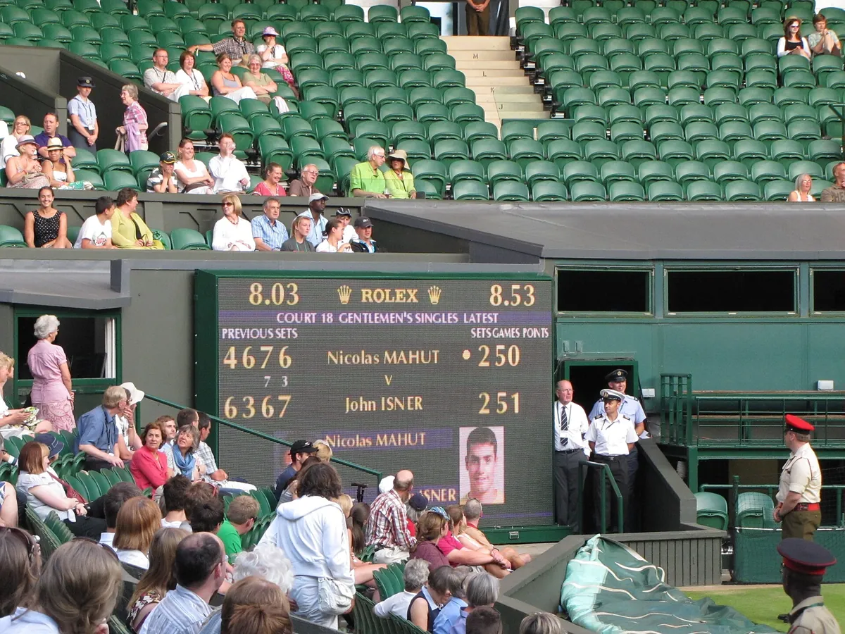 A Wimbledon scoreboard showing Nicolas Mahut on 50 games and John Isner on 51 in the fifth set of their 2010 match